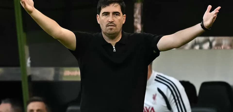 Coach gesturing from the sidelines during match