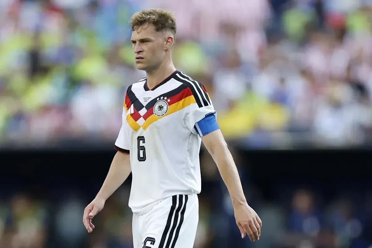 Player wearing Germany jersey walking on the field