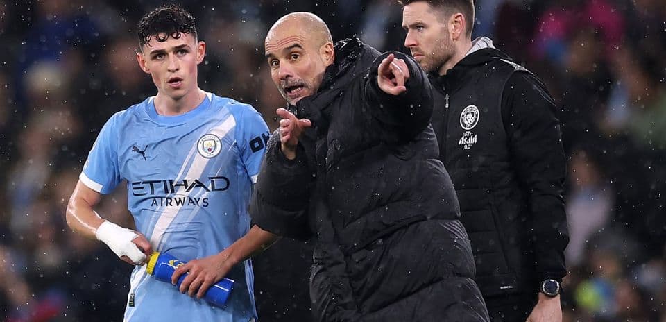 Pep Guardiola giving instructions to player during match