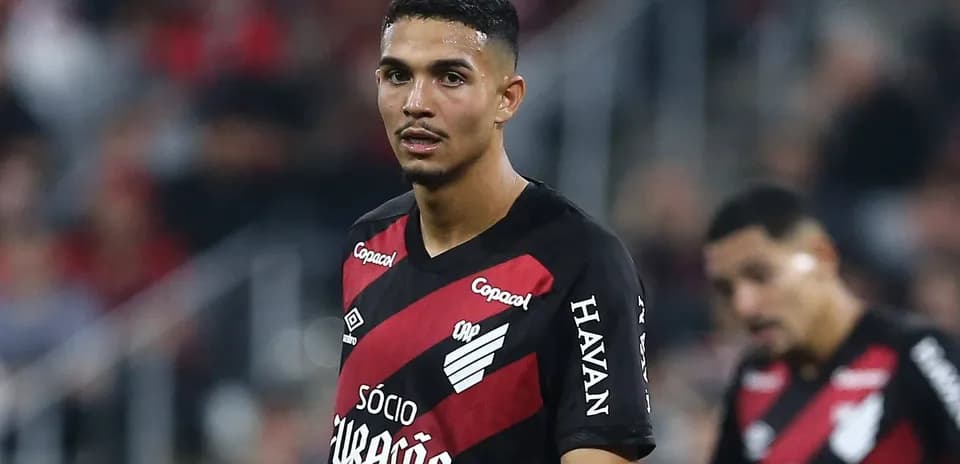 Player in red and black jersey during match