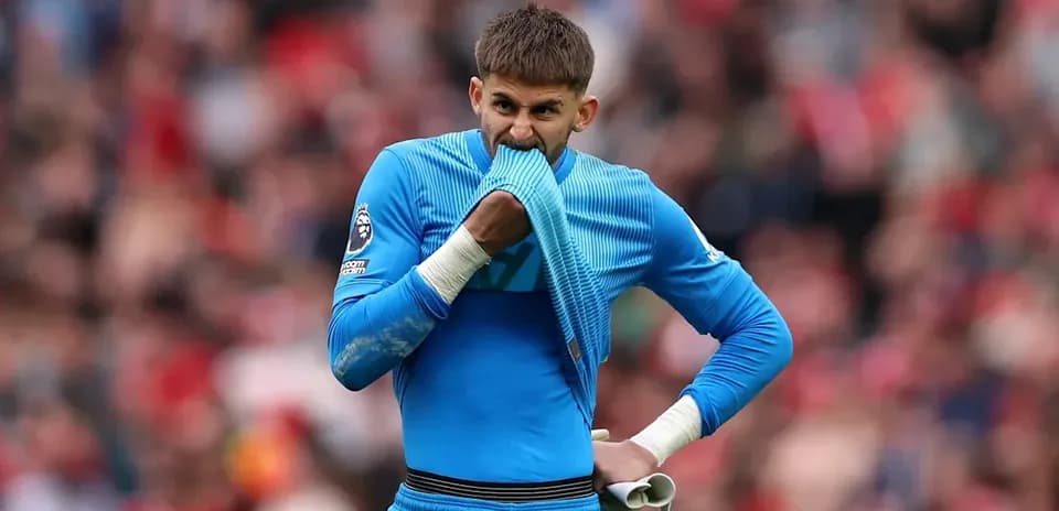 Goalkeeper biting his jersey during a match