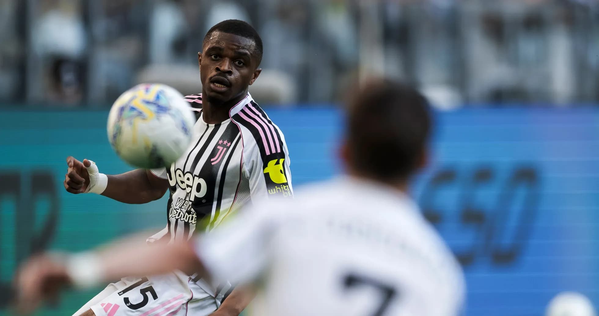 Juventus player controlling the ball during match