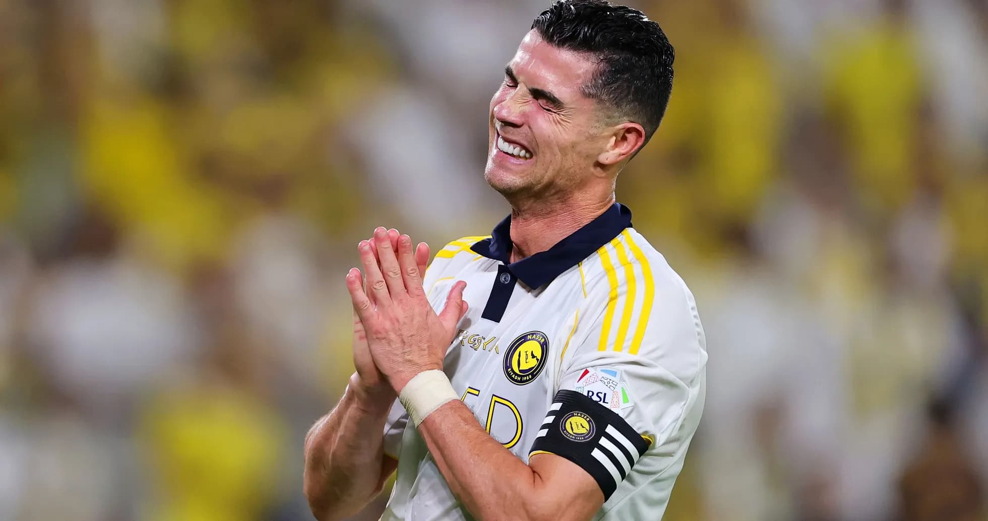 Player celebrating with hands clasped during match