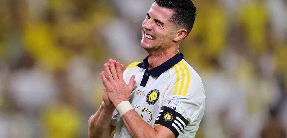 Player celebrating with hands clasped during match