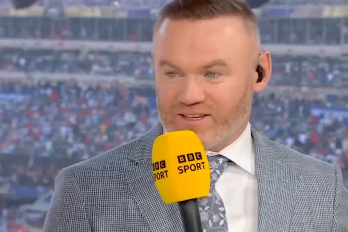 Presenter speaking into microphone at sports event