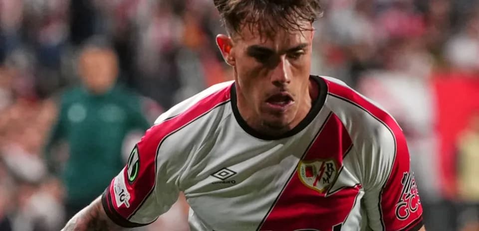 Player in Rayo Vallecano jersey running during match