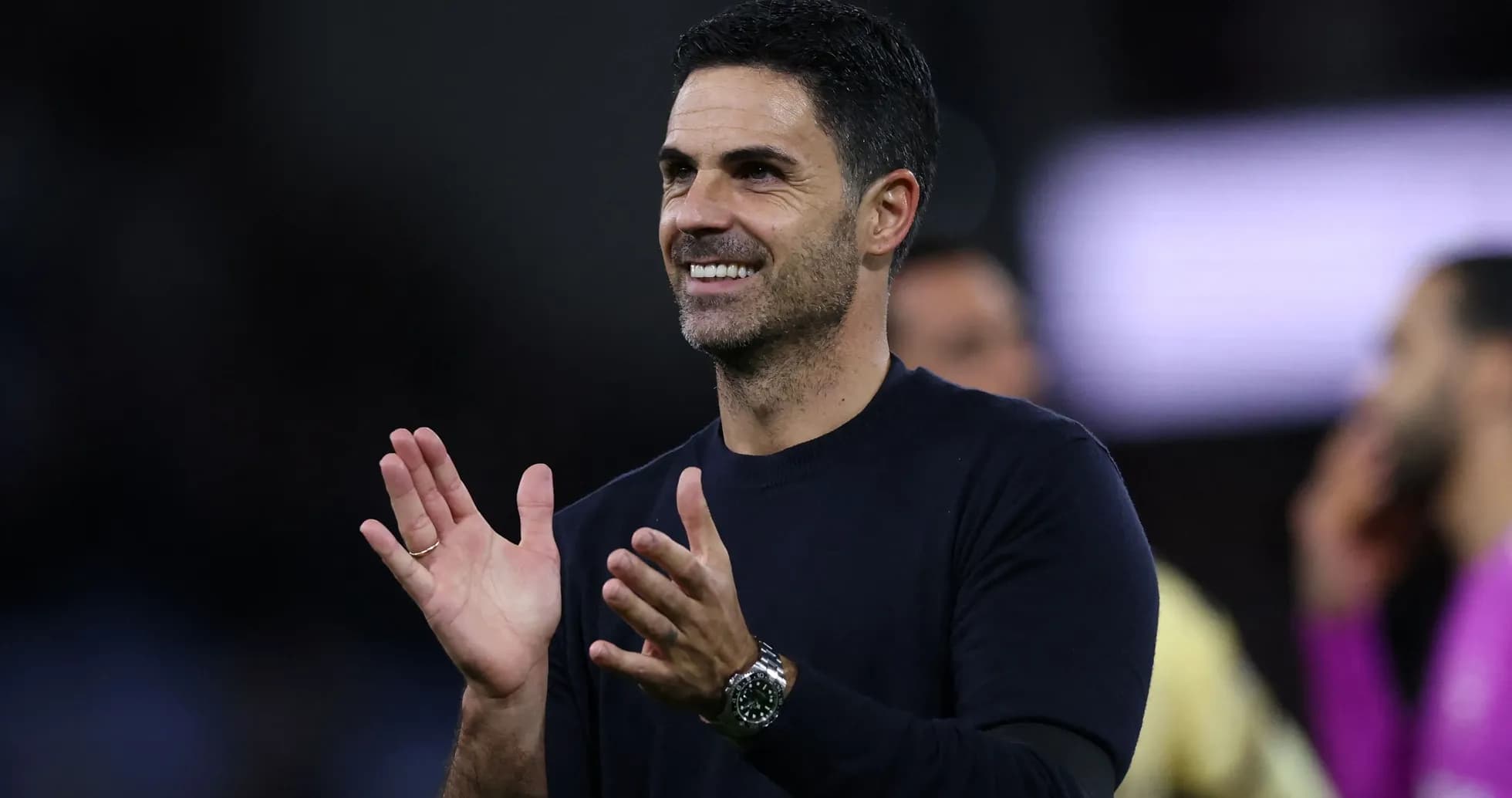 Manager clapping during a match celebration