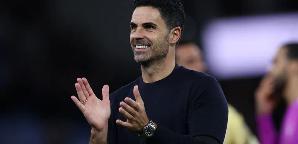 Manager clapping during a match celebration