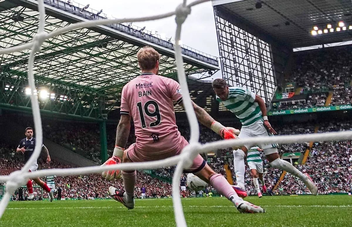 Goalkeeper Bain attempting to save a shot on goal