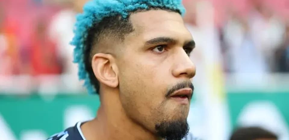 Goalkeeper with blue hair before match