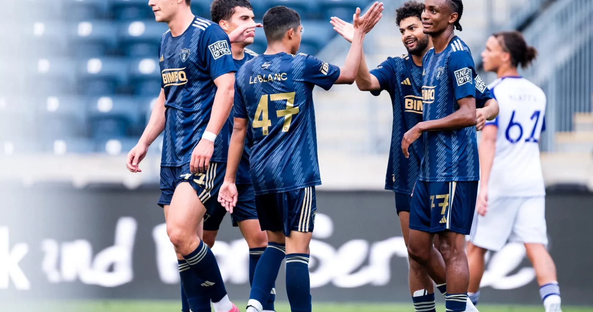 Players celebrating during Orlando City II match