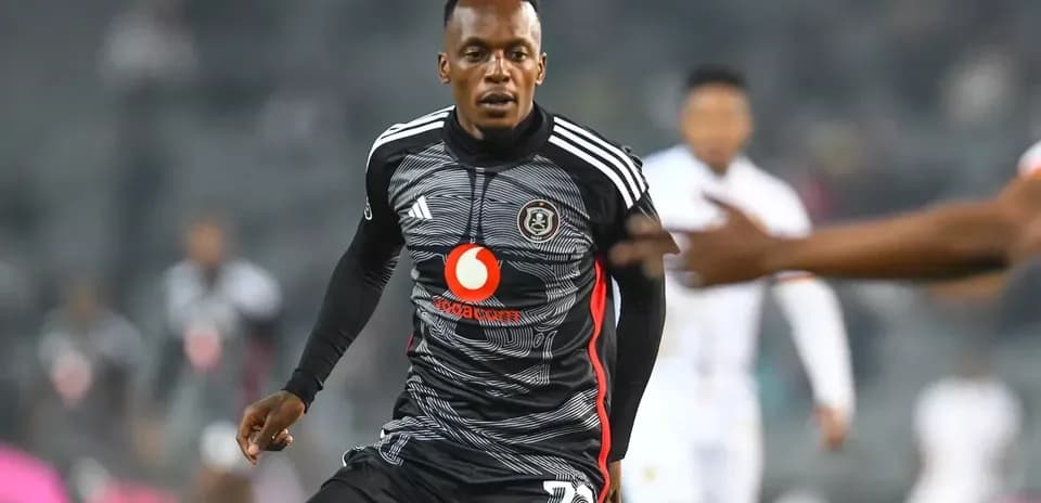 Player in action wearing Orlando Pirates kit