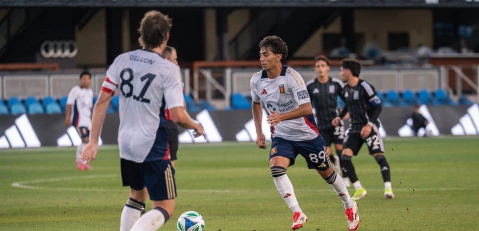Players from The Town and Real Monarchs during match