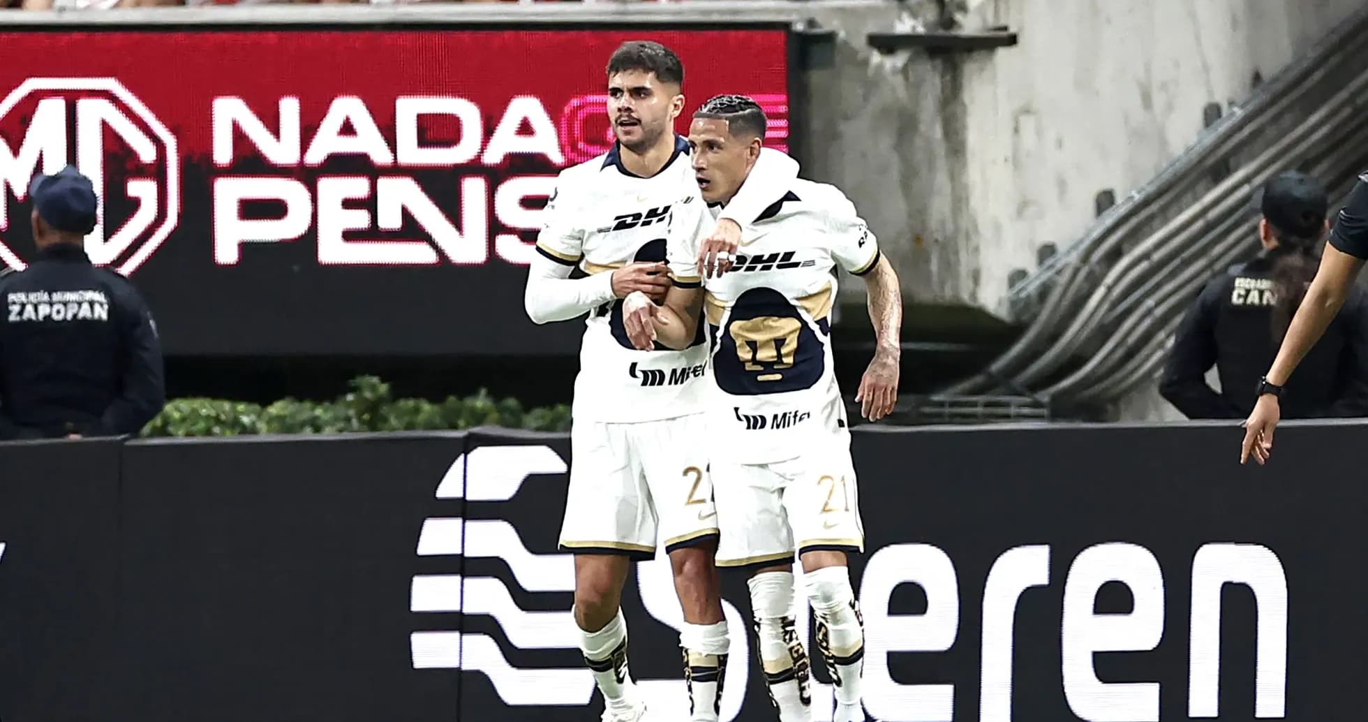 Pumas players celebrating goal during Liga MX match