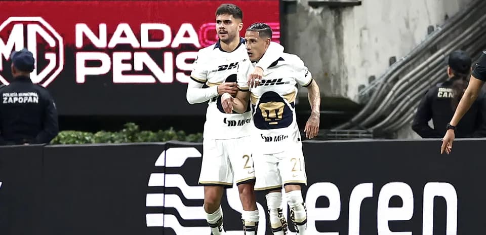 Pumas players celebrating goal during Liga MX match