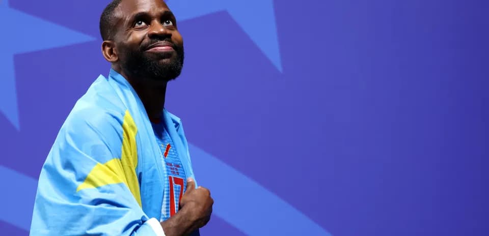 Athlete wearing a flag during a ceremony