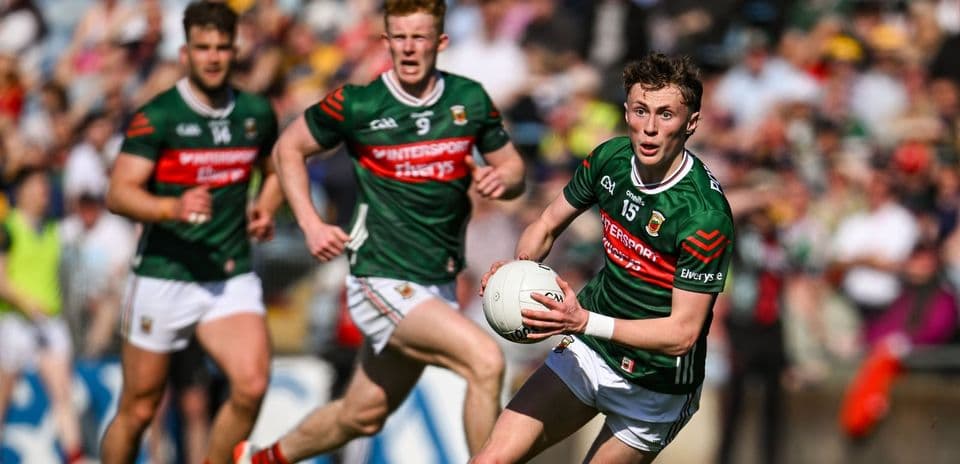 Mayo player running with the ball during match