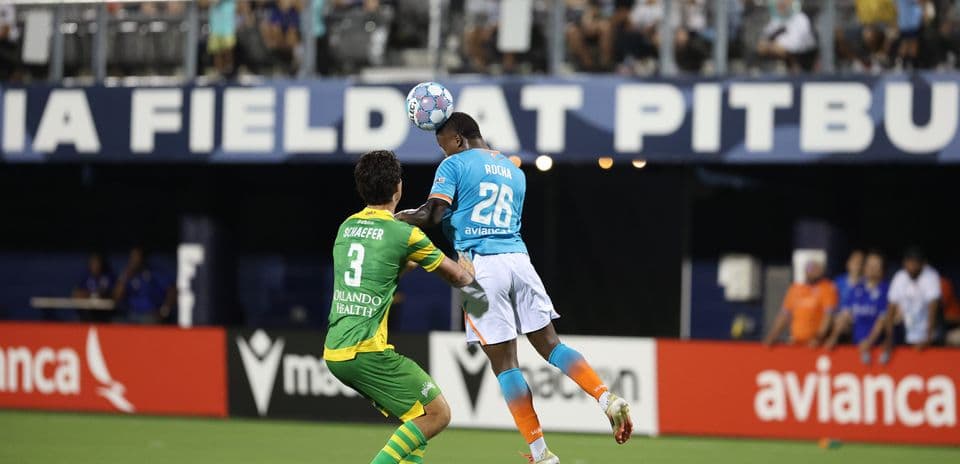Player heading the ball during Oakland Roots match