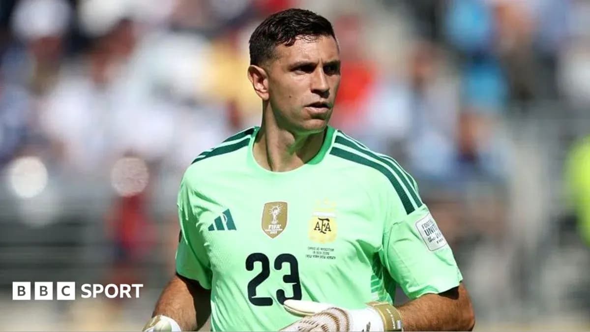 Goalkeeper in green kit during match warm-up
