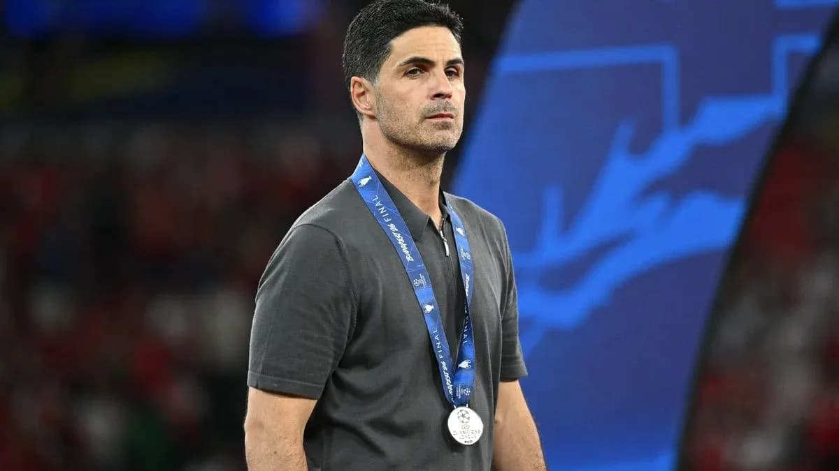 Coach wearing a silver medal at event