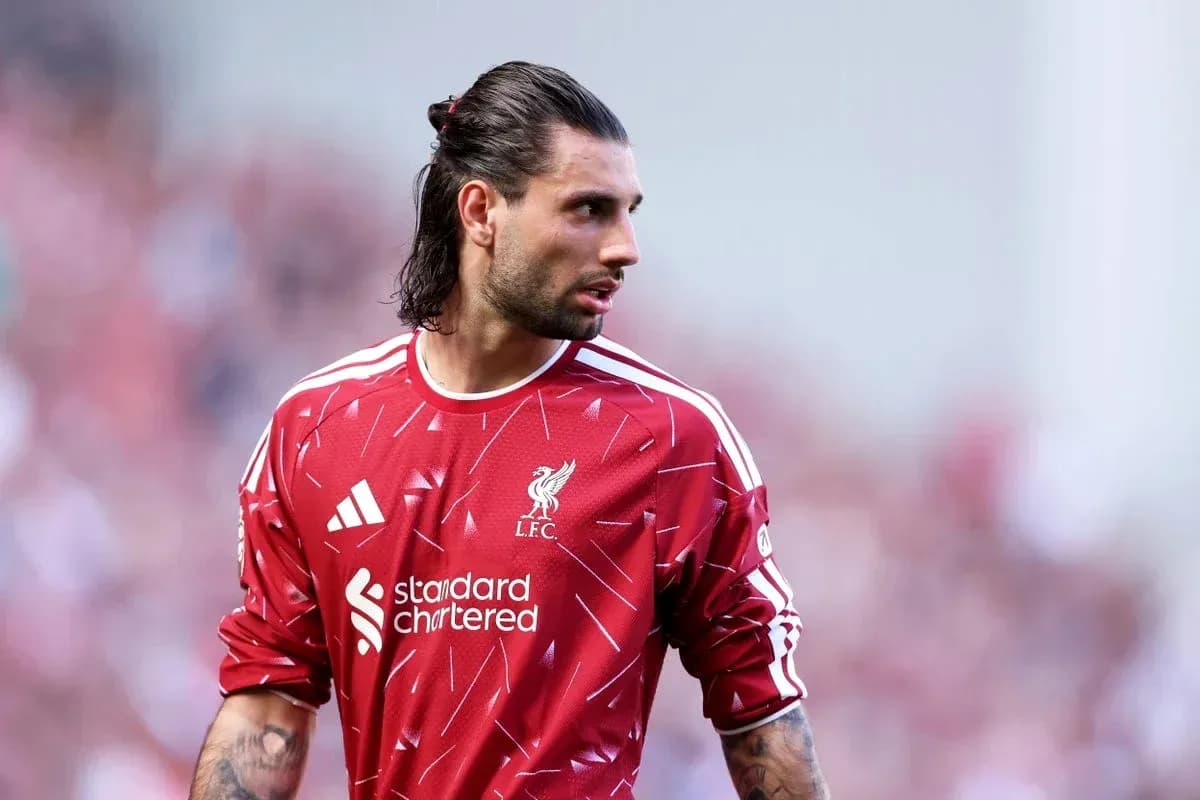 Goalkeeper in Liverpool FC jersey on the pitch