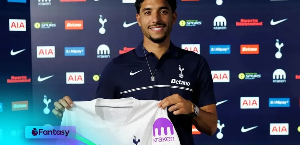 Player holding Tottenham Hotspur jersey at announcement event