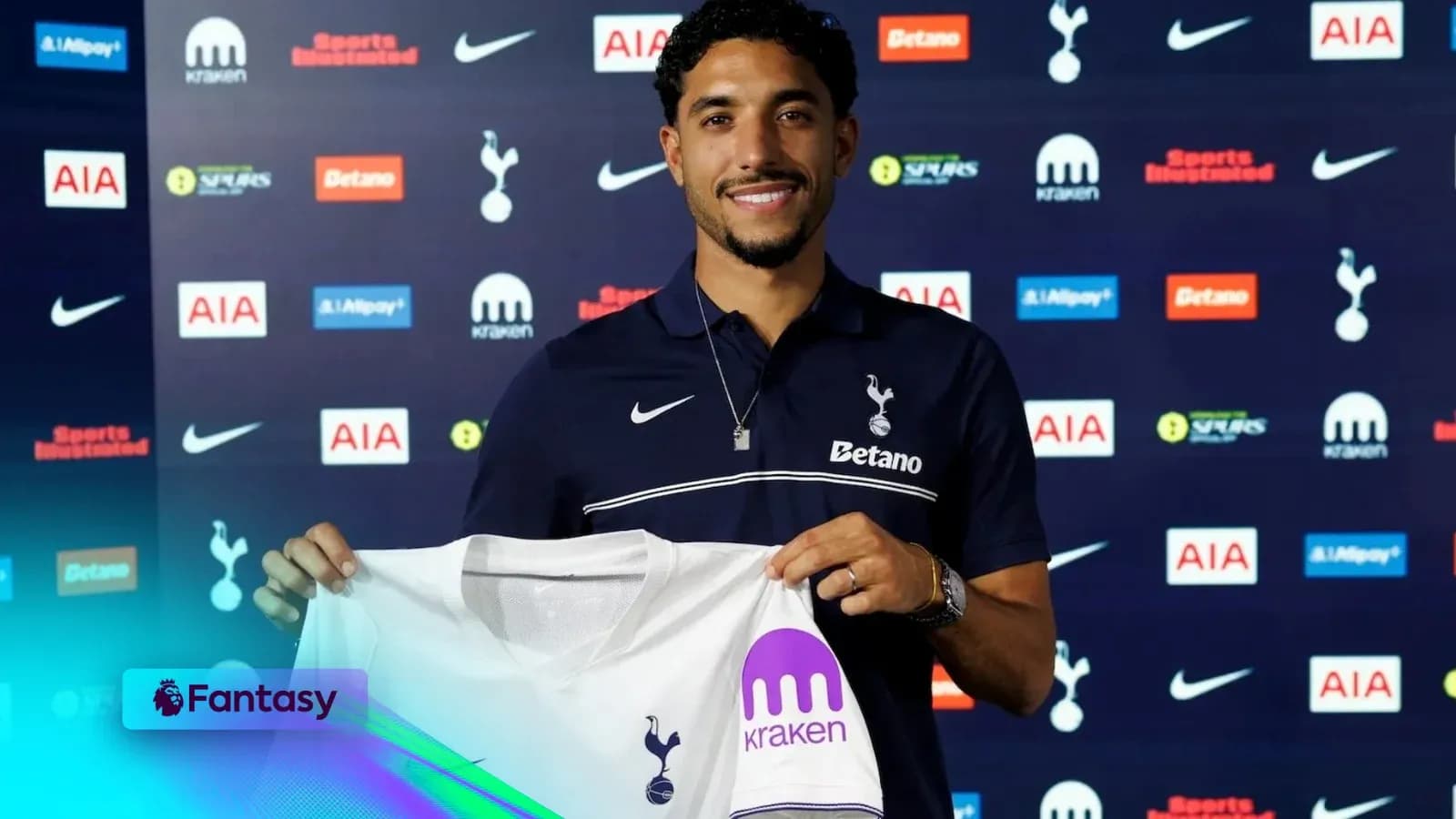 Player holding Tottenham Hotspur jersey at announcement event