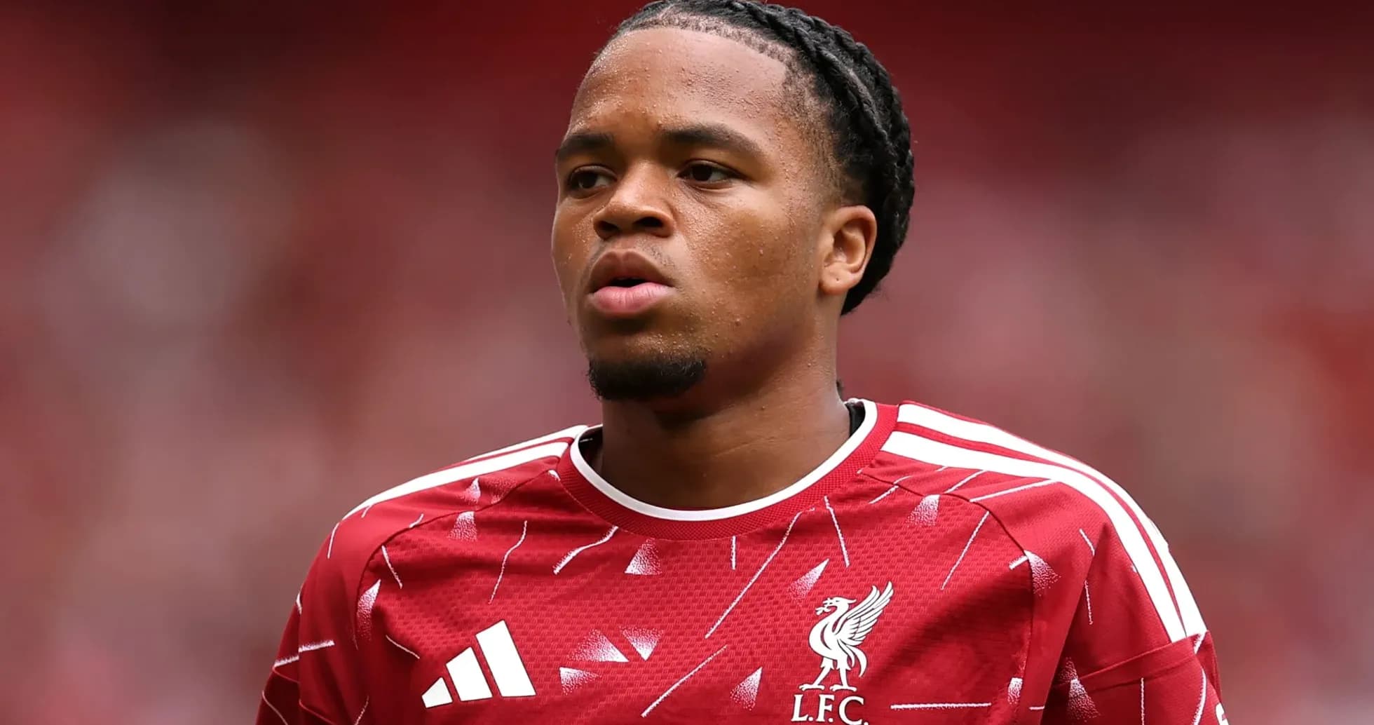 Player wearing Liverpool jersey during match warm-up