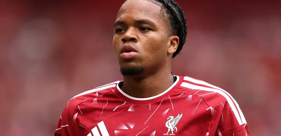 Player wearing Liverpool jersey during match warm-up