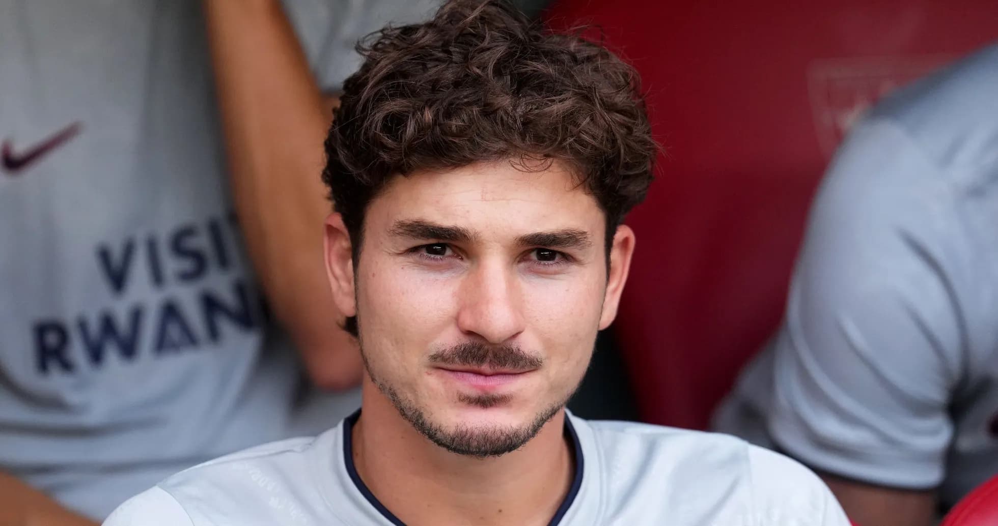 Player sitting on bench during match preparation