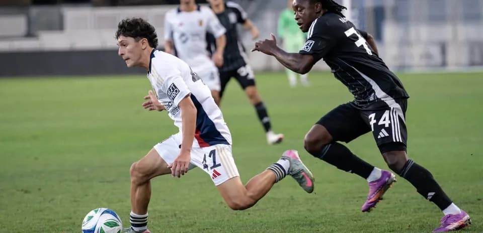 Player running with ball during MLS Next Pro match