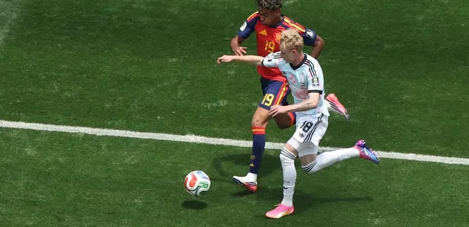 Two players battling for the ball during match