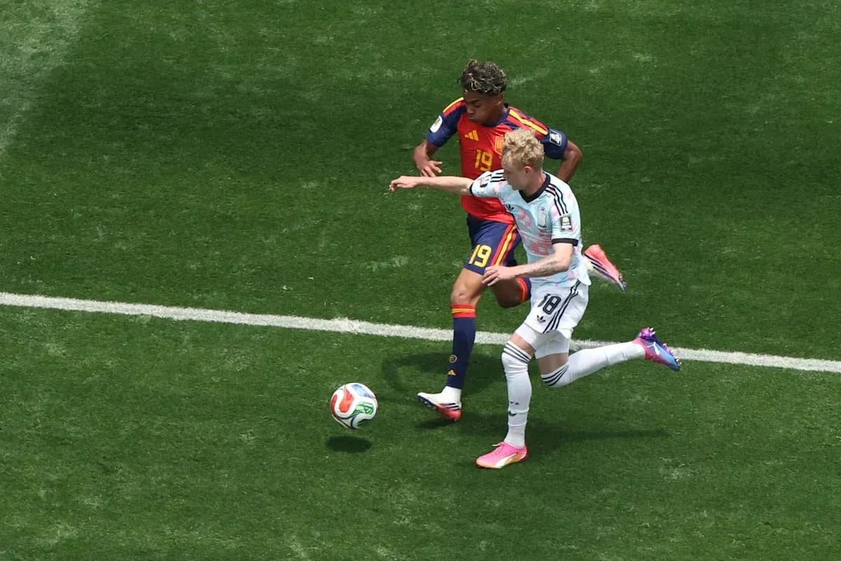 Two players battling for the ball during match