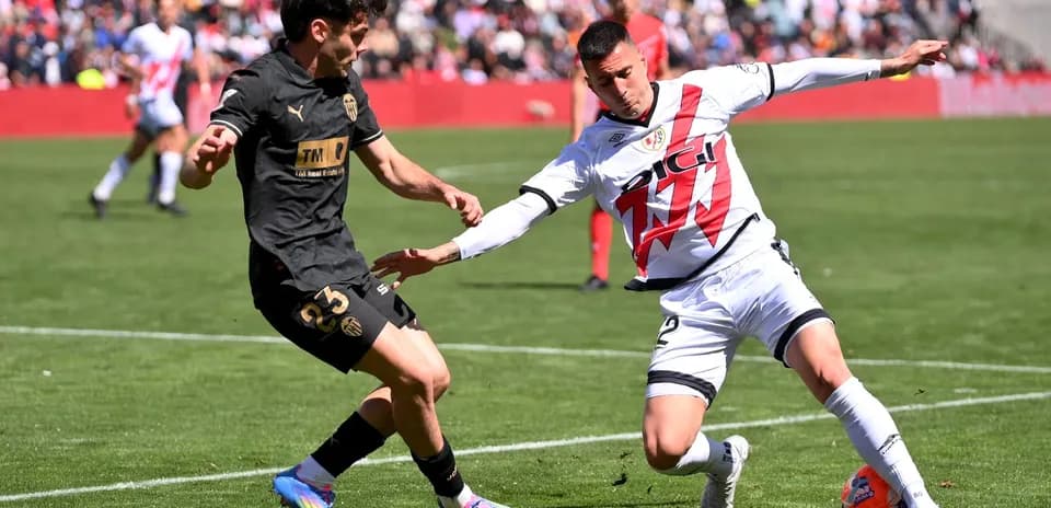 Valencia player challenges Rayo Vallecano opponent