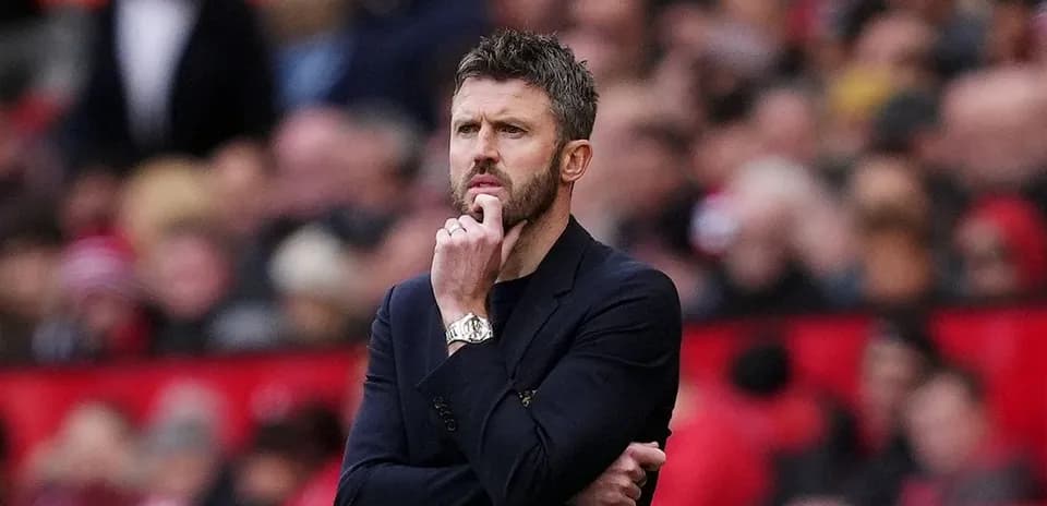 Coach observing the match from the sidelines