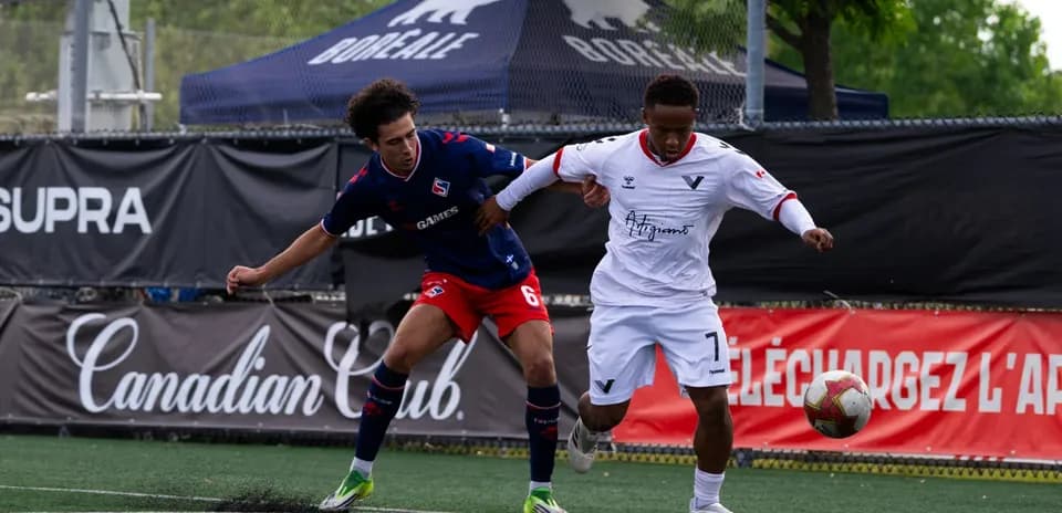 Player challenging for the ball during match
