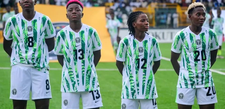 Four players in Nigeria jerseys standing together