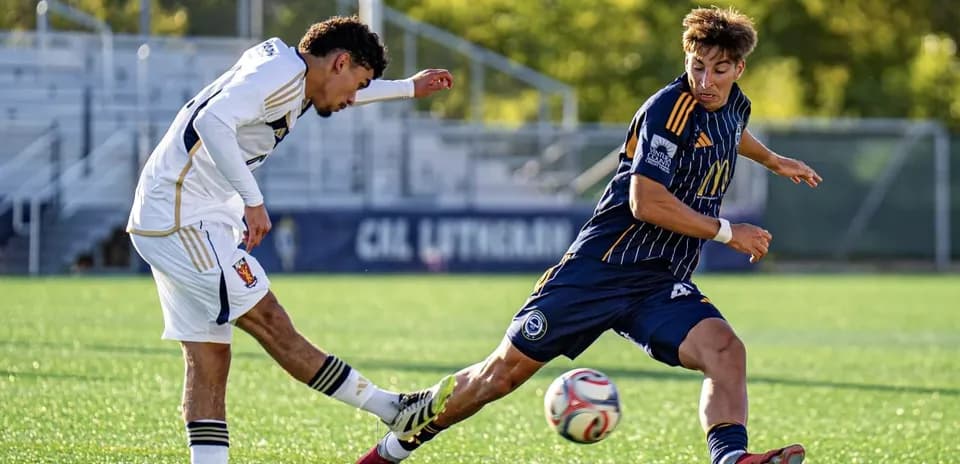 Players competing for the ball in MLS Next Pro