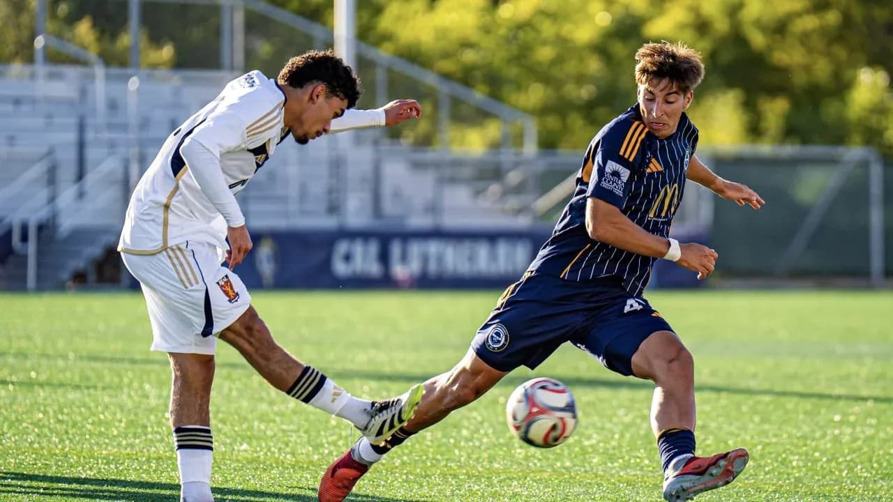 Players competing for the ball in MLS Next Pro