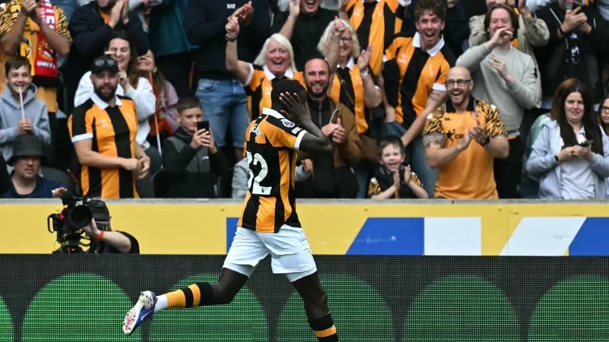 Player celebrating in front of cheering fans