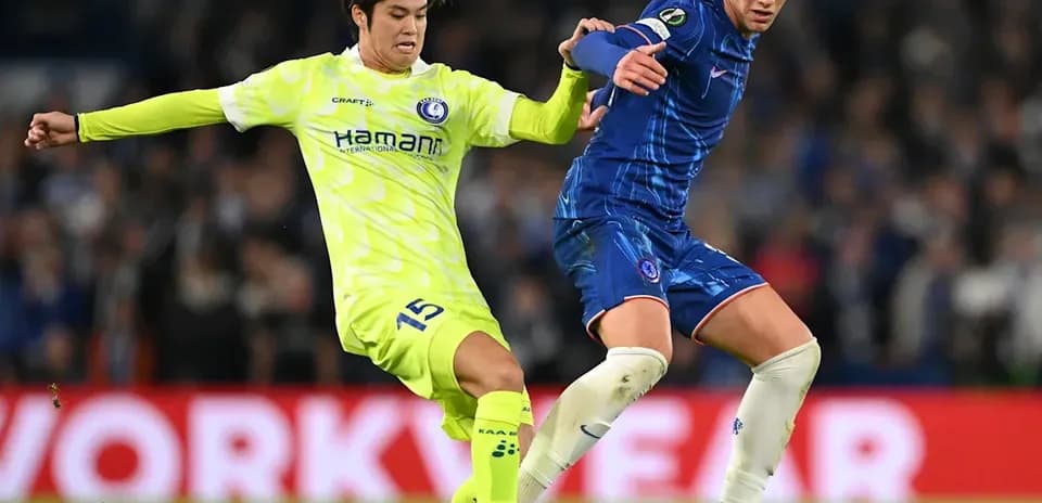Two players competing for the ball during match