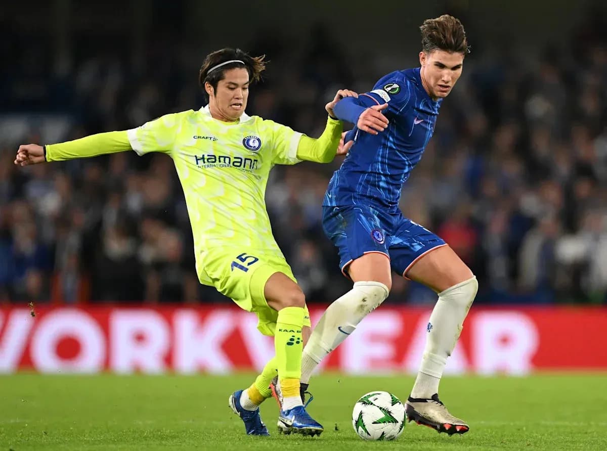 Two players competing for the ball during match