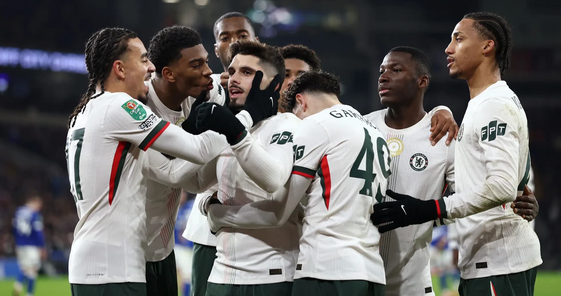 Chelsea players celebrating a goal on the pitch