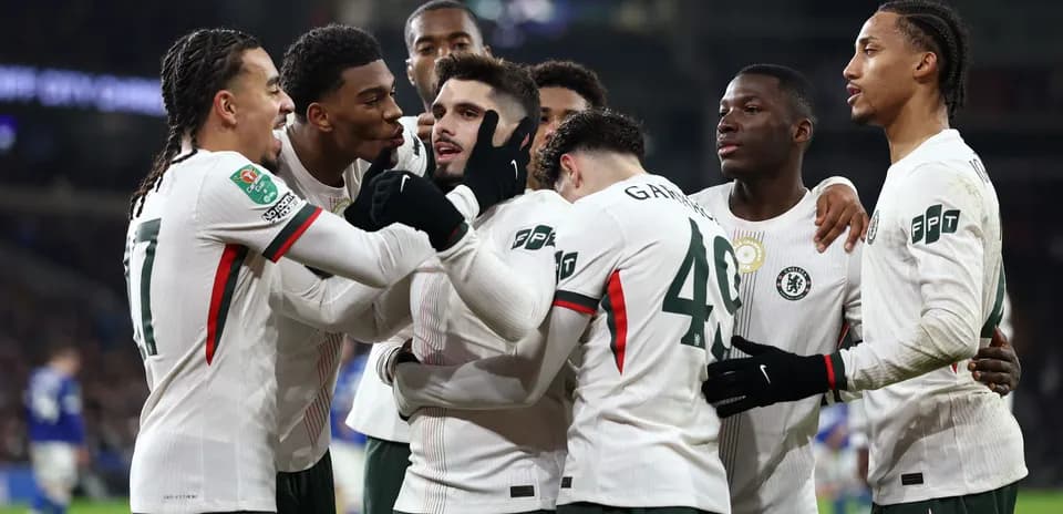 Chelsea players celebrating a goal on the pitch