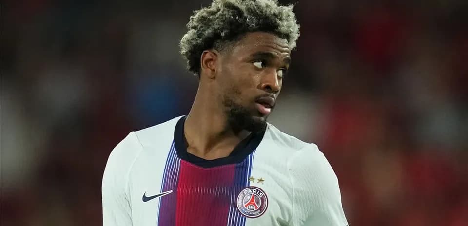 Player in PSG kit during match action