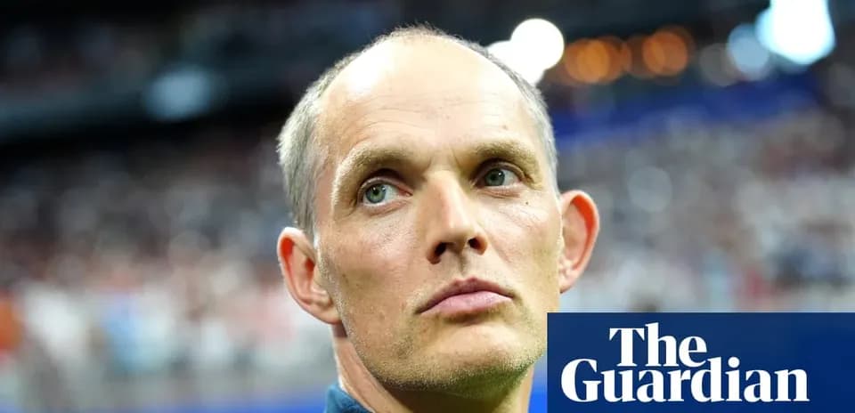 Football manager observing match from sidelines