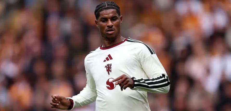 Player wearing white kit during match action