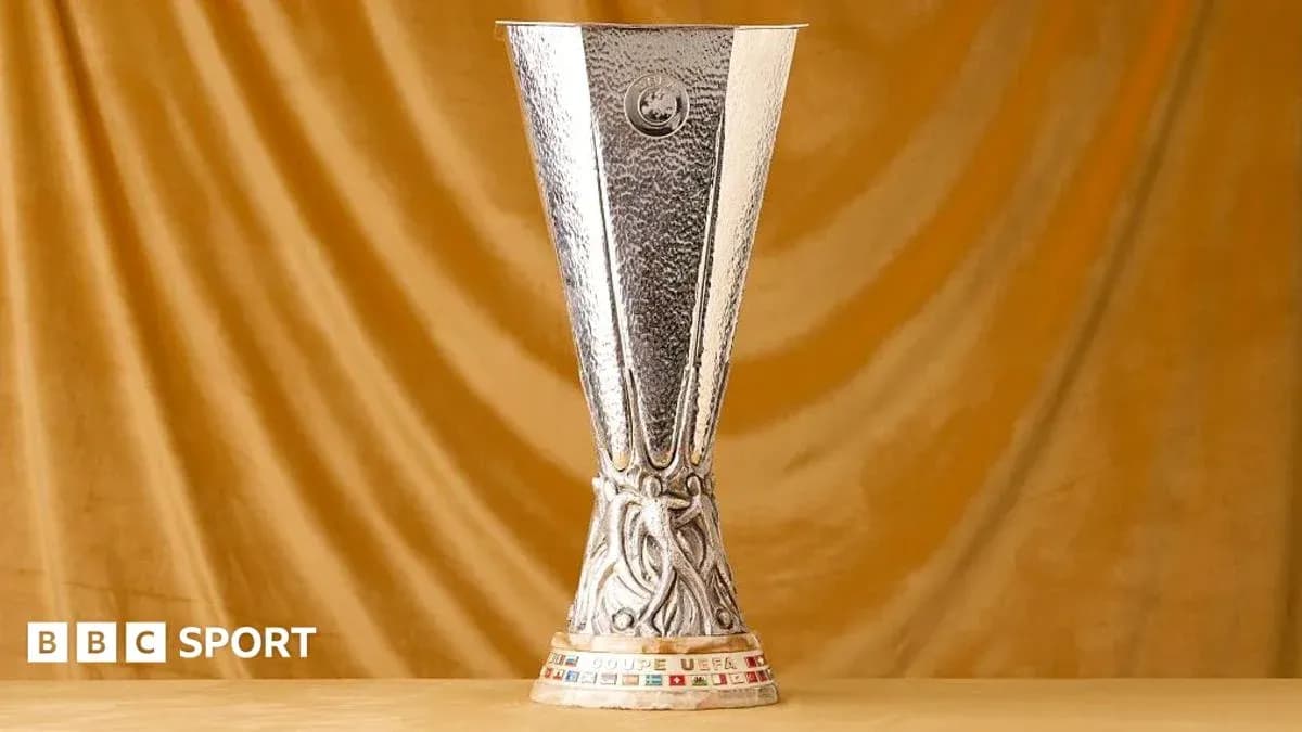 UEFA Europa League trophy on golden background