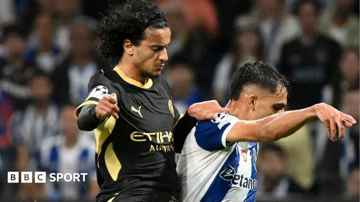 Player tackling opponent during Champions League match