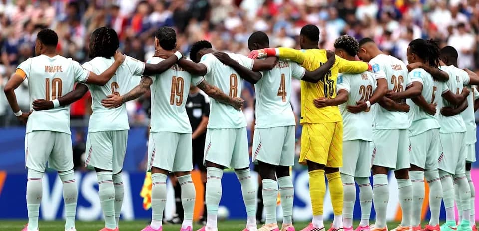 Players standing in line with arms around each other